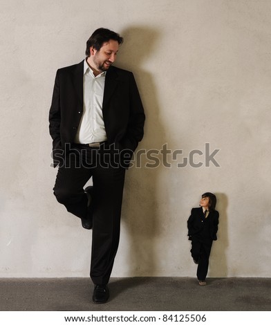 stock photo Two businessmen Very very big and very small