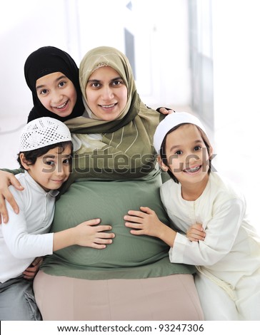 happy muslim family expecting the baby