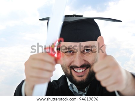 excited graduate student in gown
