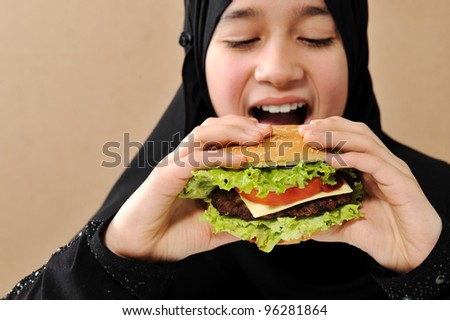 Arabic girl eating burger