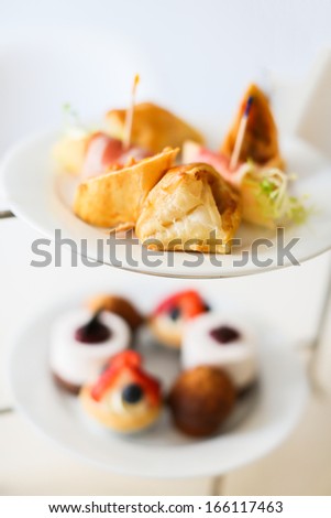 English high tea setting with bread and cakes