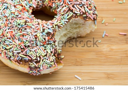 Colourful Chocolate Donut with a bite