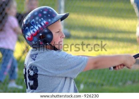 Boy catching baseball.
