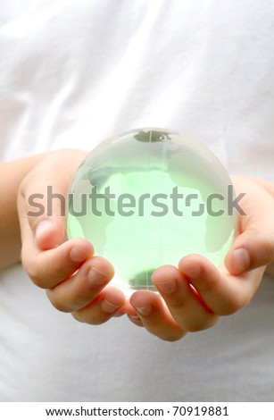 glass ball planet in the hands of children