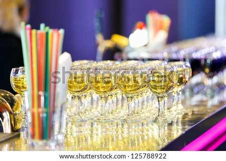 Glasses with white and red wine on the bar