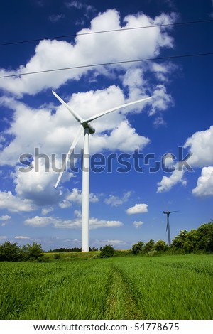 Wind power plant in european countryside. Second propeller hidden in shadow.