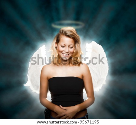 Beautiful young woman posing as innocent angel