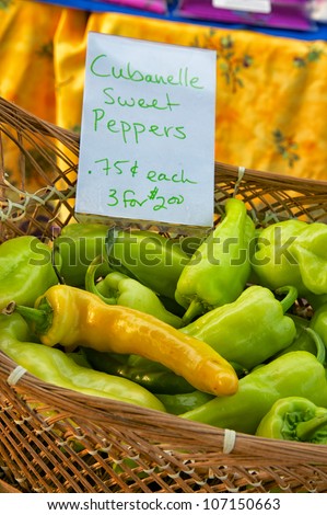 Closeup of basket of just harvested sweet peppers at farmers market