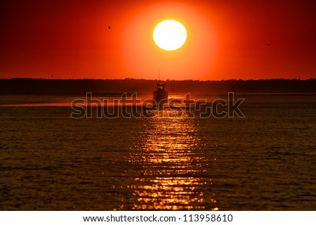 Fishing Boat at sunset on the Indian River, Delaware