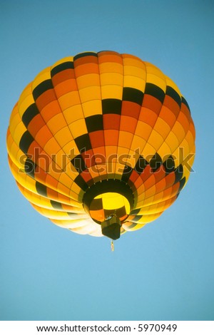 Hot air balloon lifting off at first light