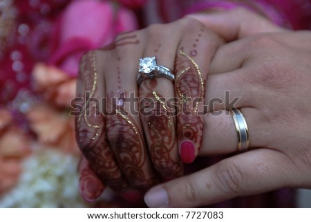 stock photo Bride and Groom exchanging rings as part of Hindu wedding 