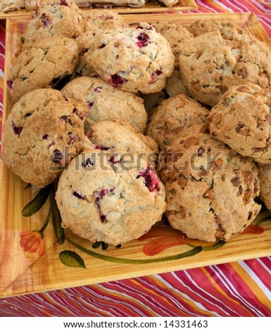 Plate of just baked butterscotch and cranberry scones on sale at local farm market