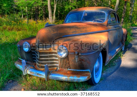 Old rusting abandoned vintage American auto