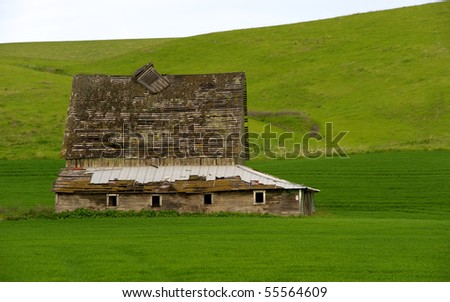 Old abandoned barn in advanced stage of decay in the Palouse region of Washington state in the US