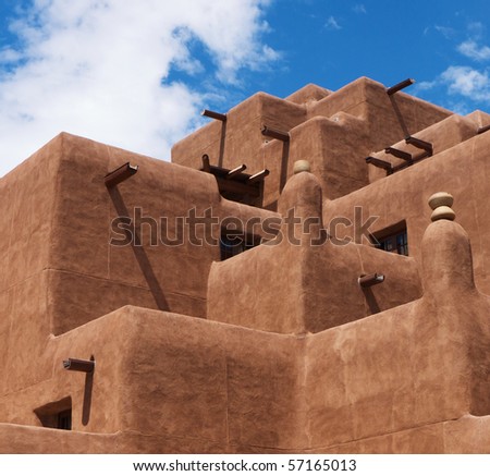 Traditional New Mexico adobe architecture against blue sky