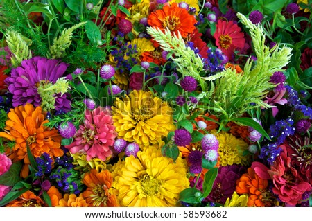 Horizontal photo of just picked summer flowers at local farm market