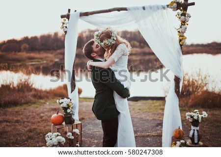 bride and groom on wedding ceremony on rustic autumn wedding