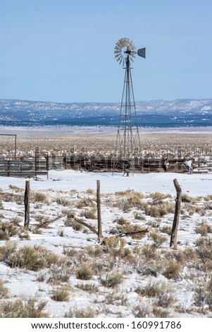 windmill on ranch North Plains of New Mexico.  New Mexico landscape
