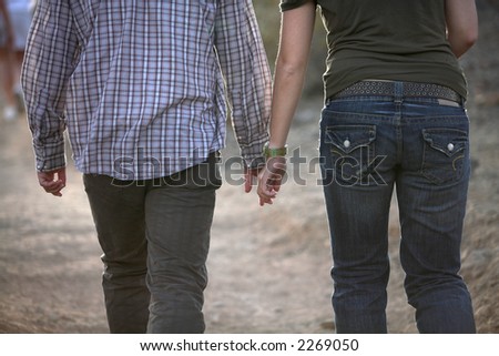 stock photo : Lovers Holding Hands While Walking