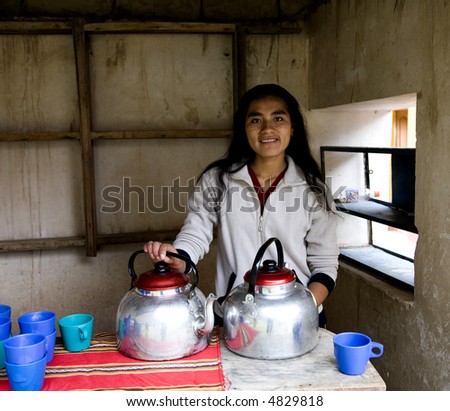 Pretty Peruvian Woman Serving Coca Tea in the Sacred Valley