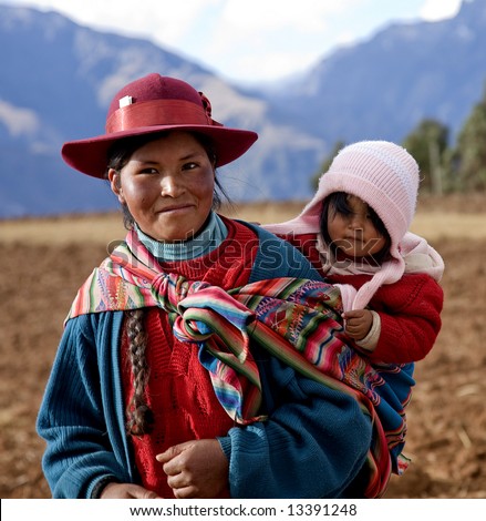 Peruvian Woman and Baby in Native Clothing in Sacred Valley Peru