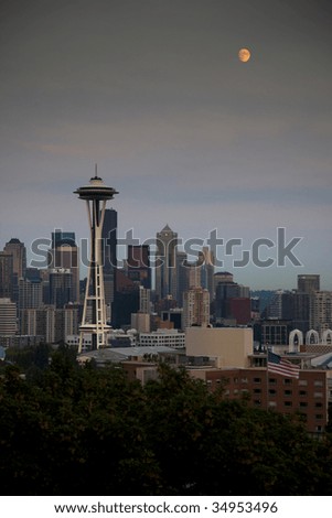 Classic Skyline of Seattle at Sundown from Queen Anne Neighborhood from Kerry Park with Full Moon