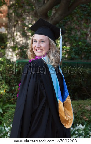 Beautiful Young Women Smiling College Graduation in Cap and Gown