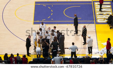 LOS ANGELES, CA. – DECEMBER 25: Players in Huddle with Coach Phil Jackson during Christmas Day NBA Game L.A. Lakers versus the Miami Heat at Staples Center. on December 25, 2010 in Los Angeles.