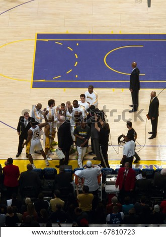 LOS ANGELES, CA. – DECEMBER 25: Players in huddle with Coach Phil Jackson during Christmas Day NBA Game L.A. Lakers versus the Miami Heat at Staples Center. on December 25, 2010 in Los Angeles.