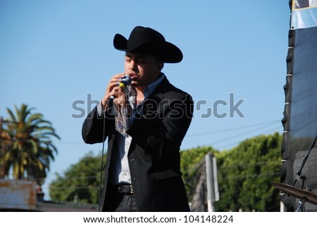  - stock-photo-los-angeles-ca-may-singer-enrique-valle-performs-at-the-th-annual-florence-firestone-104148224