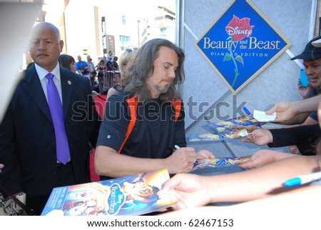 HOLLYWOOD, CA- OCTOBER 2: Actor Robby Benson (C) arrives at Walt Disney Studios Beauty and The Beast Sing-Along at the El Capitan Theatre on October 2, 2010 in Hollywood, California.