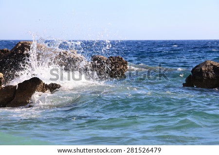 Waves break againstthe rocks. Island Hvar, Croatia, Adriatic Sea. waves break / batter against the rocks