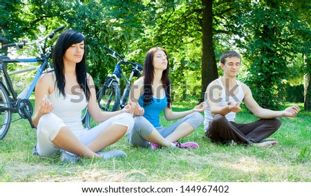 Three young cyclists meditate on the nature of