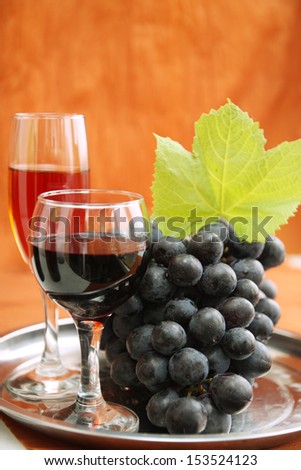 still life with wine bottle, wine glass and grapes