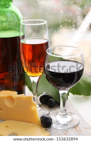 still life with wine bottle, wine glass and grapes