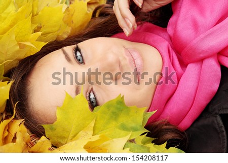 happy woman wearing a wreath of yellow leaves