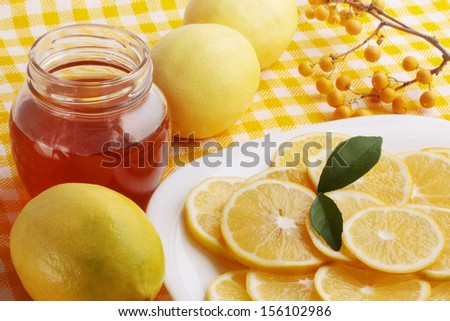Flavored honey and lemon on a plate