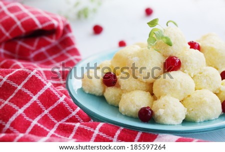 lazy dumplings with cranberries on a plate