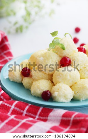 lazy dumplings with cranberries on a plate