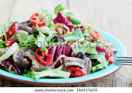 Salad with fried mushrooms onion and chili