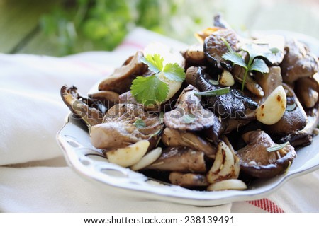 Fried mushrooms with garlic and fresh coriander