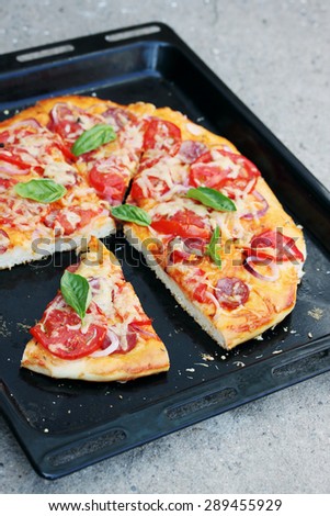 homemade pizza on a black pan