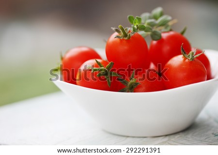small bowl of cherry tomatoes on the table