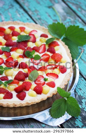 cake with a shortcrust pastry, custard fruit cherries and strawberries