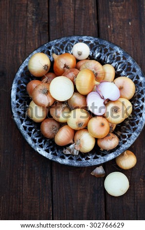 small onion in an old bowl