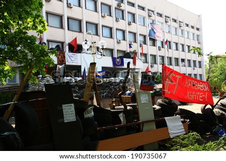 MARIUPOL, UKRAINE - MAY 4, 2014: Supporters of federalization of Ukraine at the City Council building, blocked by barricades.