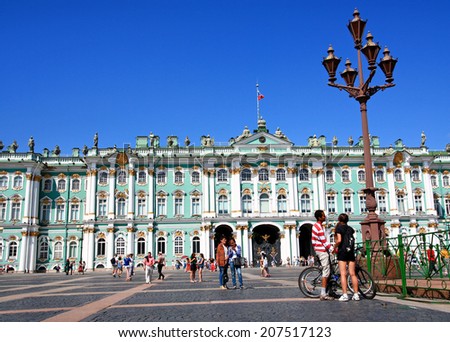 RUSSIA, SAINT - PETERSBURG - JULY 17, 2014 :Tourists about the Winter Palace - the most beautiful buildings of the Palace square.
