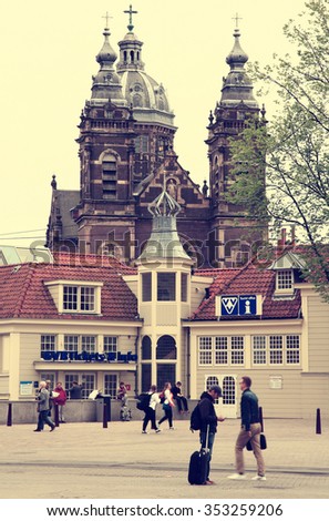 NETHERLANDS. AMSTERDAM - JUNE 23, 2015: Tourist Information Centre against the backdrop of the Temple of St. Nicholas.