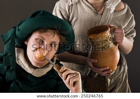 Hungry man in medieval suit