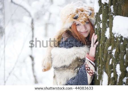 beautiful red hair woman in fox fur
